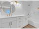 Bright bathroom with white vanity, marble accent wall, gold fixtures, and shower-tub combo at 2110 Los Feliz St # 1037, Las Vegas, NV 89156