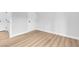 This is a bedroom with hard wood flooring, white walls, and white doors at 2110 Los Feliz St # 1037, Las Vegas, NV 89156