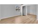 A bedroom with sliding mirror closet, light wood floors, and a window at 2110 Los Feliz St # 1037, Las Vegas, NV 89156