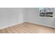 This is a bedroom with hard wood flooring, white walls, and a window at 2110 Los Feliz St # 1037, Las Vegas, NV 89156