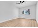 This bedroom features sleek ceiling fan, light wood flooring, and a window that provides natural light at 2110 Los Feliz St # 1037, Las Vegas, NV 89156