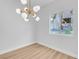 Bright room featuring a stylish light fixture, neutral walls, and a view to the outside at 2110 Los Feliz St # 1037, Las Vegas, NV 89156