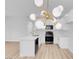Modern kitchen with quartz countertops, stainless appliances, stylish lighting, and white cabinetry at 2110 Los Feliz St # 1037, Las Vegas, NV 89156