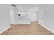Bright living room with wood floors and view of the kitchen and entry door at 2110 Los Feliz St # 1037, Las Vegas, NV 89156