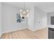 A modern dining and living area with neutral walls, great lighting, and beautiful flooring at 2110 Los Feliz St # 1037, Las Vegas, NV 89156
