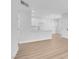 Bright living room with wood floors, modern lighting, and a kitchen view at 2110 Los Feliz St # 1037, Las Vegas, NV 89156