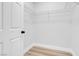 A spacious walk-in closet with custom shelving and modern flooring at 2110 Los Feliz St # 1037, Las Vegas, NV 89156