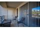 Condo balcony featuring tile flooring, metal rails, and seating furniture at 220 E Flamingo Rd # 129, Las Vegas, NV 89169