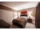 Cozy bedroom boasts a comfortable bed, side tables, and an art piece above the headboard at 220 E Flamingo Rd # 129, Las Vegas, NV 89169