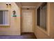 Front door entrance to condo featuring light colored walls and black door hardware at 220 E Flamingo Rd # 129, Las Vegas, NV 89169