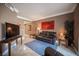 Spacious living room with tile floors, neutral colors, ample seating and art at 220 E Flamingo Rd # 129, Las Vegas, NV 89169