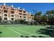 Tennis court featuring a green court with a net for the tennis enthusiast at 220 E Flamingo Rd # 129, Las Vegas, NV 89169