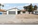 Charming single-story home featuring a gray garage door and low-maintenance front yard at 2236 E Hacienda Ave, Las Vegas, NV 89119