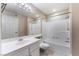 Bathroom showcases a white vanity, toilet, and shower-tub combination with tile surround at 2251 Wigwam Pkwy # 923, Henderson, NV 89074