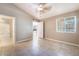 Neutral bedroom boasting vaulted ceiling and tiled floors, connecting to a bathroom and kitchen at 2251 Wigwam Pkwy # 923, Henderson, NV 89074