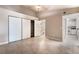 Spacious bedroom featuring tiled floors, closet, and connects to bathroom and kitchen at 2251 Wigwam Pkwy # 923, Henderson, NV 89074