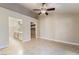 Spacious bedroom with tile flooring, ceiling fan, and attached bathroom with double vanity at 2251 Wigwam Pkwy # 923, Henderson, NV 89074