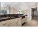 Bright kitchen featuring granite countertops, white cabinets, and tile floors at 2251 Wigwam Pkwy # 923, Henderson, NV 89074