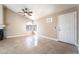 Bright living room with tile flooring, vaulted ceiling, and arched window at 2251 Wigwam Pkwy # 923, Henderson, NV 89074
