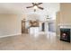 Open-concept living area with tile flooring, fireplace, and access to the kitchen at 2251 Wigwam Pkwy # 923, Henderson, NV 89074