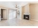 Living area with a fireplace, large windows, and a ceiling fan for comfort at 2251 Wigwam Pkwy # 923, Henderson, NV 89074