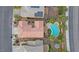 An aerial view of a home showcasing a pool, desert landscaping, and solar panels at 2445 Rue Royale, Henderson, NV 89044
