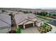 Aerial view showcases a well-maintained single-Gathering home with a tile roof and desert landscaping at 2539 Ballatore St, Henderson, NV 89044