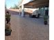 The backyard features gravel landscaping, a covered patio area, and outdoor seating, perfect for entertaining or relaxing at 2539 Ballatore St, Henderson, NV 89044