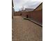 A low-maintenance backyard featuring gravel, brick walls, and decorative rock borders enhance outdoor living at 2539 Ballatore St, Henderson, NV 89044