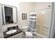 Neutral bathroom features a shower-tub combo and black hardware at 2539 Ballatore St, Henderson, NV 89044