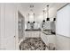 Bright bathroom with a double sink vanity, decorative rug, and walk-in shower at 2539 Ballatore St, Henderson, NV 89044