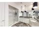 Bright bathroom featuring a double sink vanity, a walk-in shower with chrome hardware at 2539 Ballatore St, Henderson, NV 89044