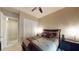 Neutral bedroom with a full bed, closet, and dark-colored nightstands at 2539 Ballatore St, Henderson, NV 89044