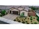 Attractive single-story home with a three-car garage, brick driveway, and well-maintained landscaping at 2539 Ballatore St, Henderson, NV 89044