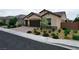 Charming single-story home with a three-car garage, desert landscaping, and welcoming curb appeal at 2539 Ballatore St, Henderson, NV 89044