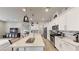 Bright kitchen featuring a center island with a sink, stainless steel appliances, and ample counter space at 2539 Ballatore St, Henderson, NV 89044