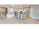 Spacious kitchen boasts white cabinets, stainless steel appliances, and a large center island with barstool seating at 2539 Ballatore St, Henderson, NV 89044