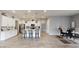 Bright kitchen with white cabinets, a center island with seating, and stainless steel appliances at 2539 Ballatore St, Henderson, NV 89044