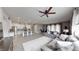 Open-concept living room features modern furnishings, wood-look flooring, and seamless flow into the kitchen at 2539 Ballatore St, Henderson, NV 89044