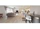 Open-concept living area with a breakfast bar, and wood-look flooring, perfect for entertaining at 2539 Ballatore St, Henderson, NV 89044