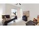 Bright home office with desk, exercise bike, and a vintage map at 2539 Ballatore St, Henderson, NV 89044