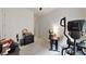 Neutral-toned home office featuring a desk, chair, and exercise equipment at 2539 Ballatore St, Henderson, NV 89044