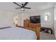 Large bedroom featuring a ceiling fan, neutral carpet, and ample natural light at 2901 Bahama Yellow Ave, North Las Vegas, NV 89086