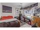 Bedroom has decorative cityscape curtain, with fan, and warm color carpet at 2901 Bahama Yellow Ave, North Las Vegas, NV 89086