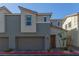 Two-story home featuring a two-car garage, desert landscaping and muted two-tone color scheme at 2901 Bahama Yellow Ave, North Las Vegas, NV 89086