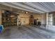 Well-organized garage interior with storage shelves and epoxy flooring, providing a clean space at 2901 Bahama Yellow Ave, North Las Vegas, NV 89086