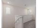 Bright upstairs hallway with white walls, neutral carpet, and natural light from multiple windows at 2901 Bahama Yellow Ave, North Las Vegas, NV 89086