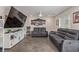 Open concept living area with sleek flooring, a ceiling fan, and modern furnishings at 2901 Bahama Yellow Ave, North Las Vegas, NV 89086