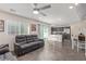 Combined living area and kitchen with sleek flooring, lots of space, and sliding glass doors at 2901 Bahama Yellow Ave, North Las Vegas, NV 89086
