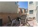 Charming outdoor patio with chairs, a fire pit, and brick pavers, perfect for entertaining at 2901 Bahama Yellow Ave, North Las Vegas, NV 89086